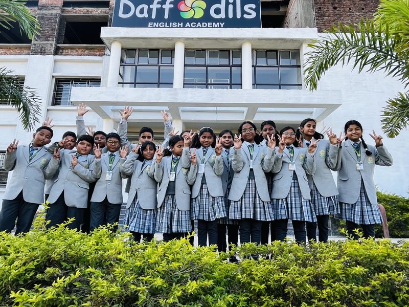 Students of Daffodils English Academy in front of the school building