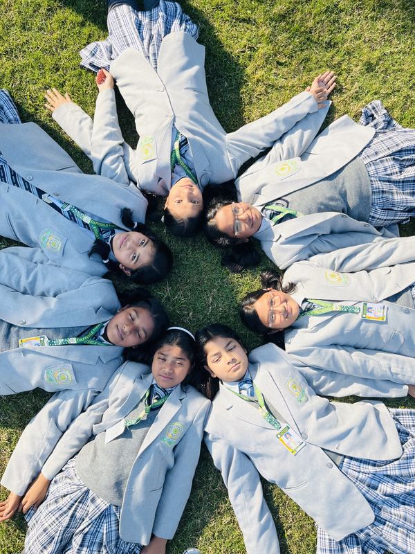 Students forming a star on the school lawn