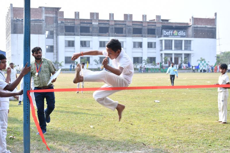 A student clearing the high jump on sports day