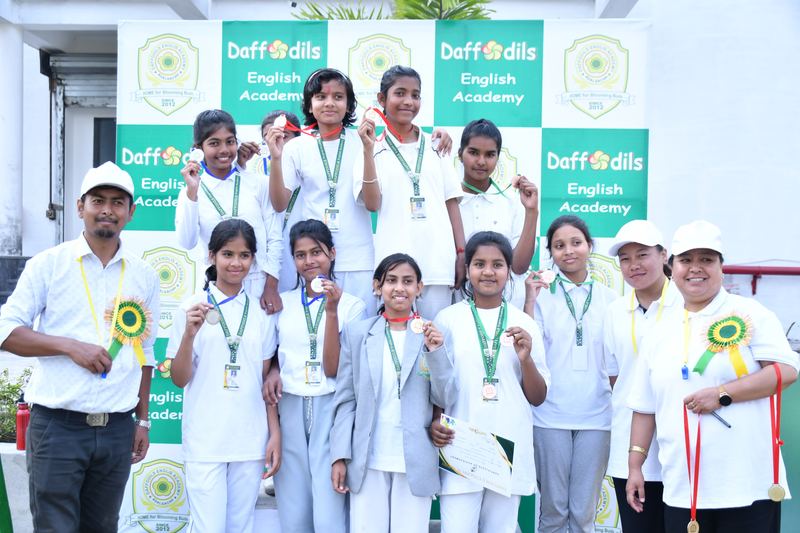 Medal winners with their teachers on sports day