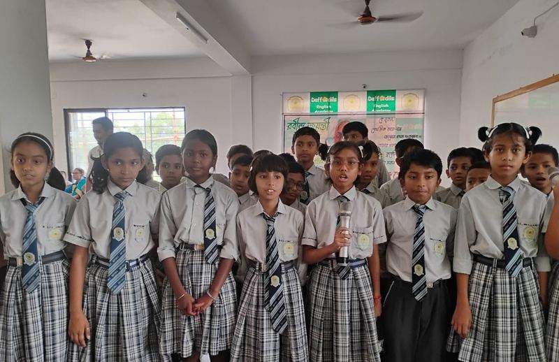 Students singing at a school celebration