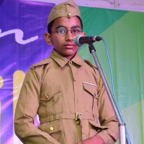 A student delivering a speech in costume